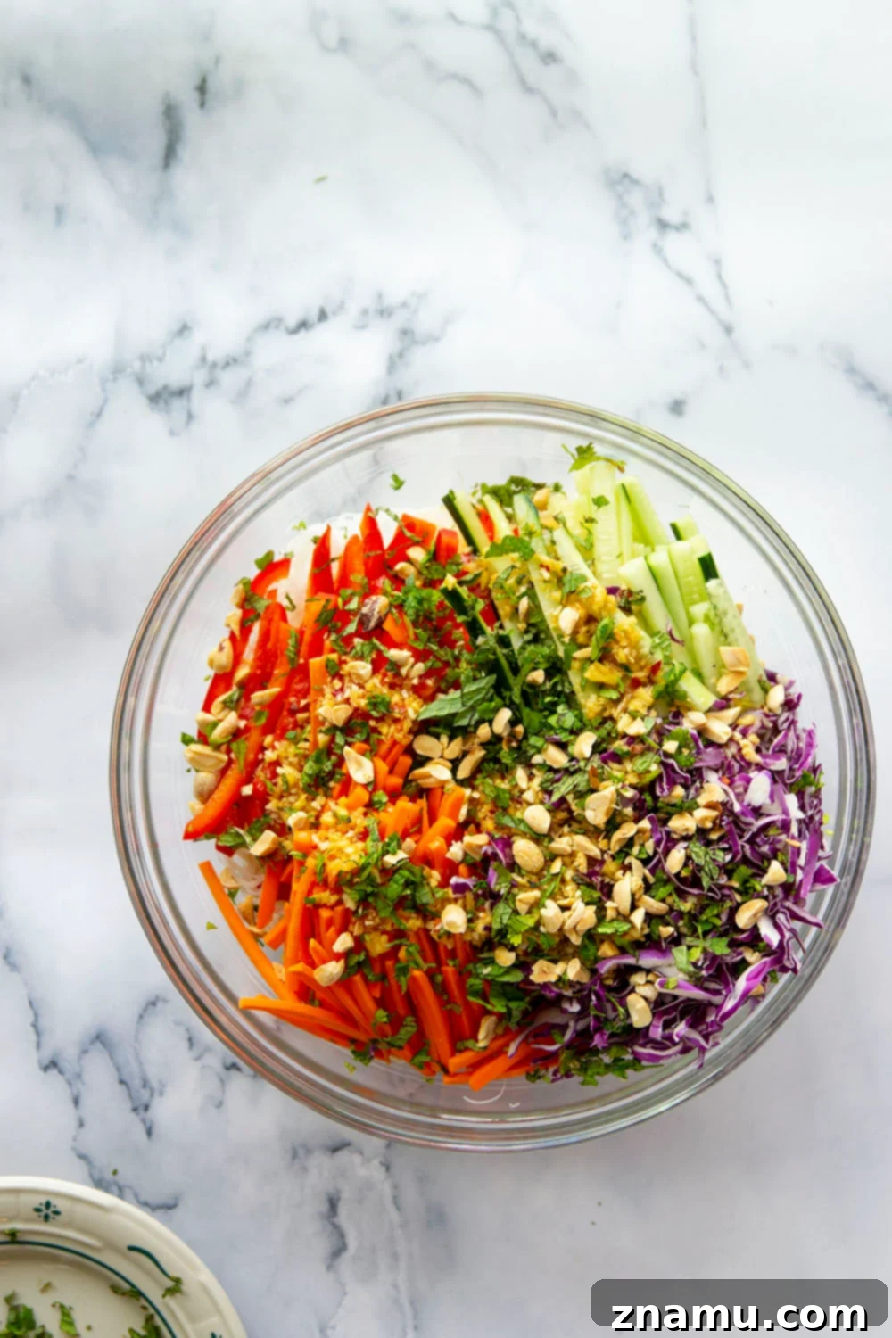 Vibrant Spring Roll Salad with Zesty Ginger Dressing 5 Another view of the prepared spring roll salad, showing the mixed vegetables and noodles before dressing, highlighting the freshness and variety of ingredients.