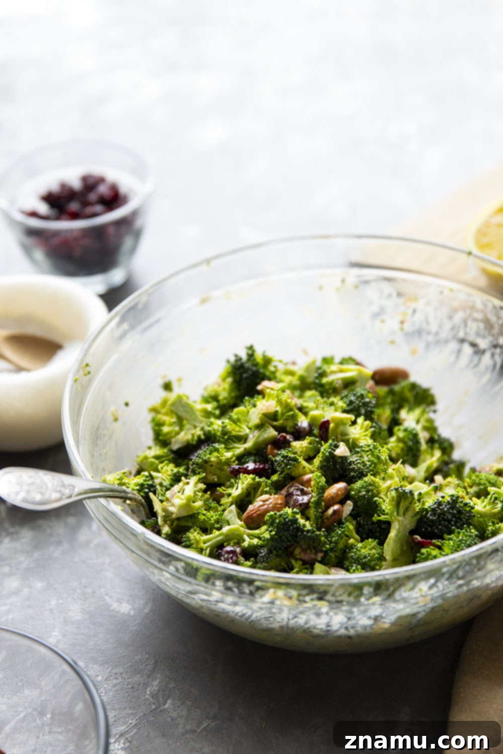 Bright Lemon Tahini Broccoli Salad with Toasted Almonds 3 This almond broccoli salad features crisp broccoli and crunchy roasted almonds tossed in a creamy lemon tahini dressing. - it will quickly become a side dish favorite!