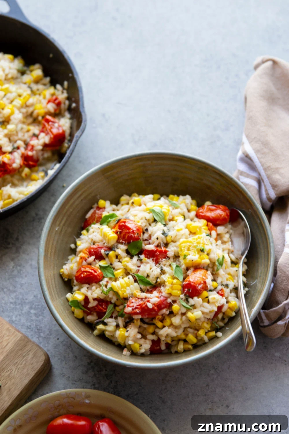 Golden Corn Risotto with Sun-Kissed Tomatoes 5 Sweet corn being cooked in broth to enhance flavor for risotto.