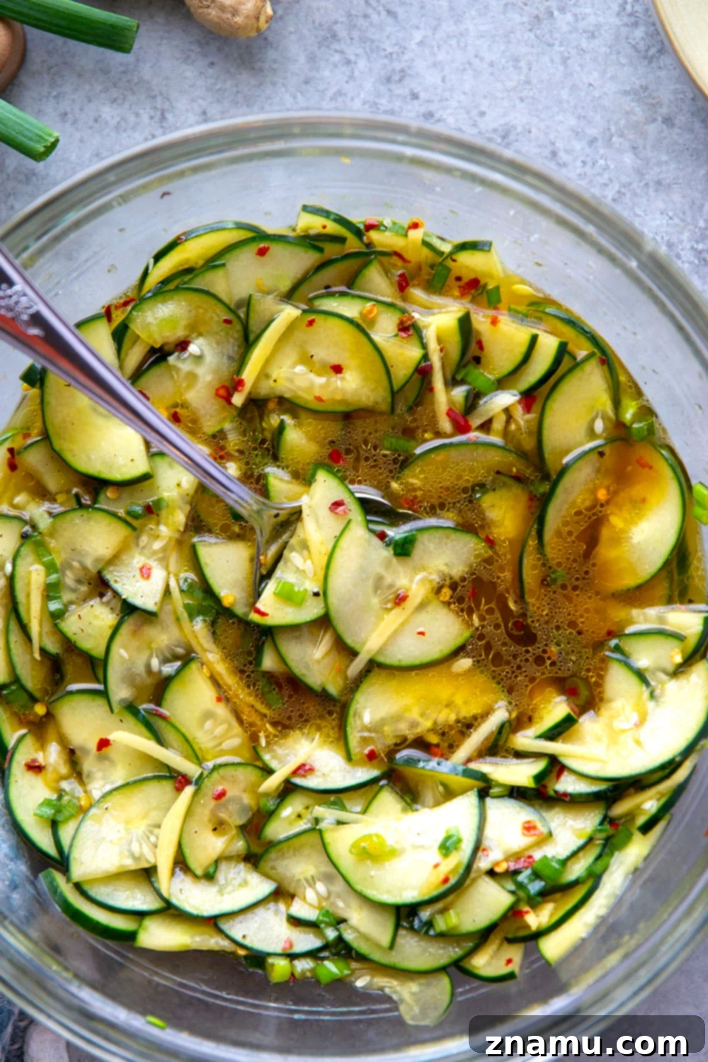 Refreshing Cucumber Ginger Salad 2 Marinated in a spicy ginger dressing and packed with crisp cucumbers, this cucumber ginger salad is a fast summer salad to pull off and perfect for an abundance of cucumbers!