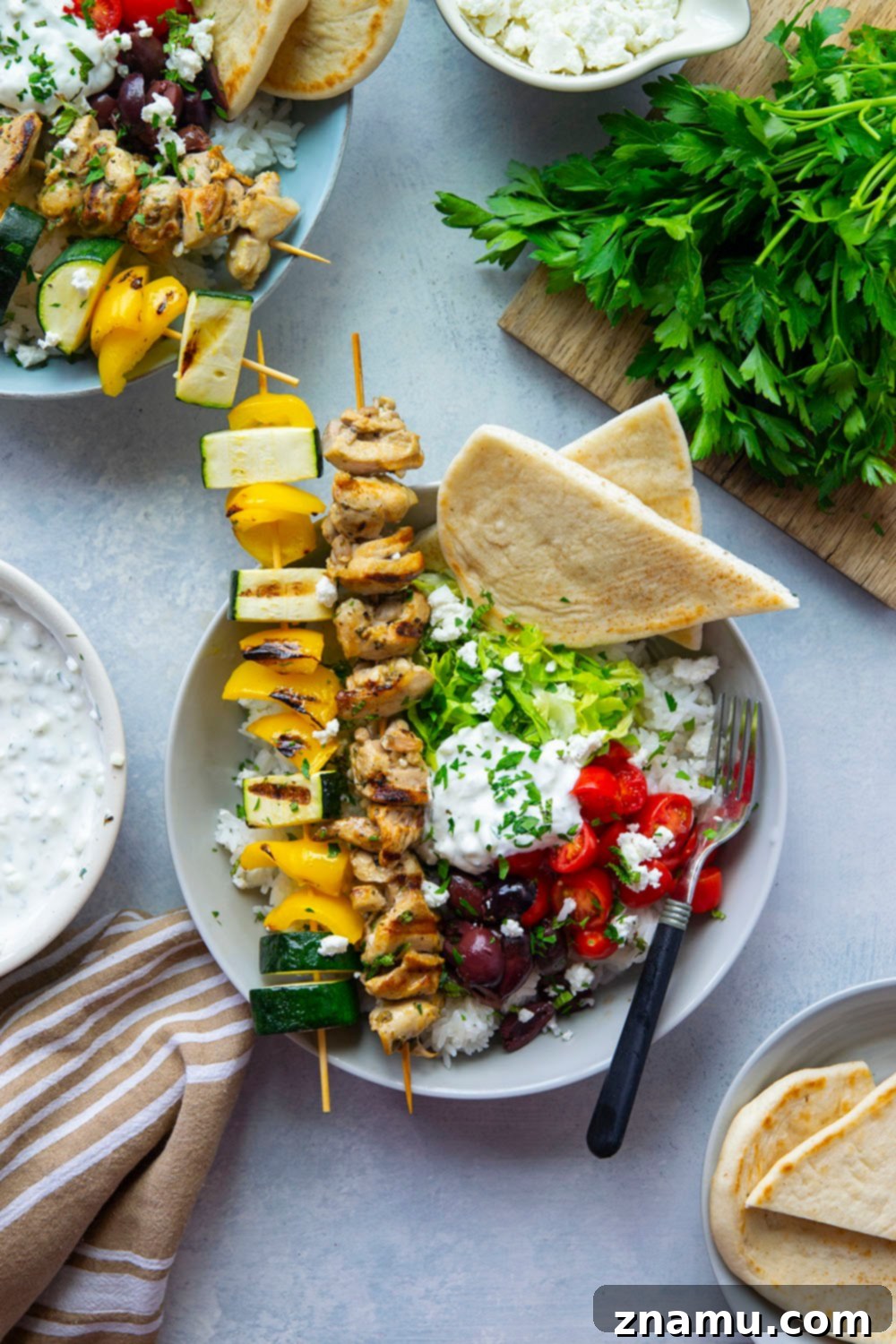 Zesty Grilled Chicken Souvlaki Bowls 3 These chicken souvlaki bowls feature flavorful grilled chicken and vegetable skewers in hearty rice bowls with homemade tzatziki sauce and lots of toppings.