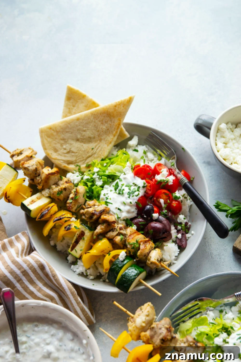 Zesty Grilled Chicken Souvlaki Bowls 6 These chicken souvlaki bowls feature flavorful grilled chicken and vegetable skewers in hearty rice bowls with homemade tzatziki sauce and lots of toppings.