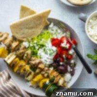 Zesty Grilled Chicken Souvlaki Bowls 8 These chicken souvlaki bowls feature flavorful grilled chicken and vegetable skewers in hearty rice bowls with homemade tzatziki sauce and lots of toppings.