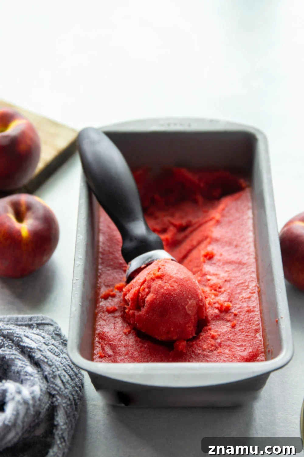 Refreshing Peach Cherry Sorbet 4 Ingredients for making peach cherry sorbet laid out: fresh peaches, cherries, honey, lemon juice, and white rum. Emphasizes the simplicity of the 5-ingredient recipe.