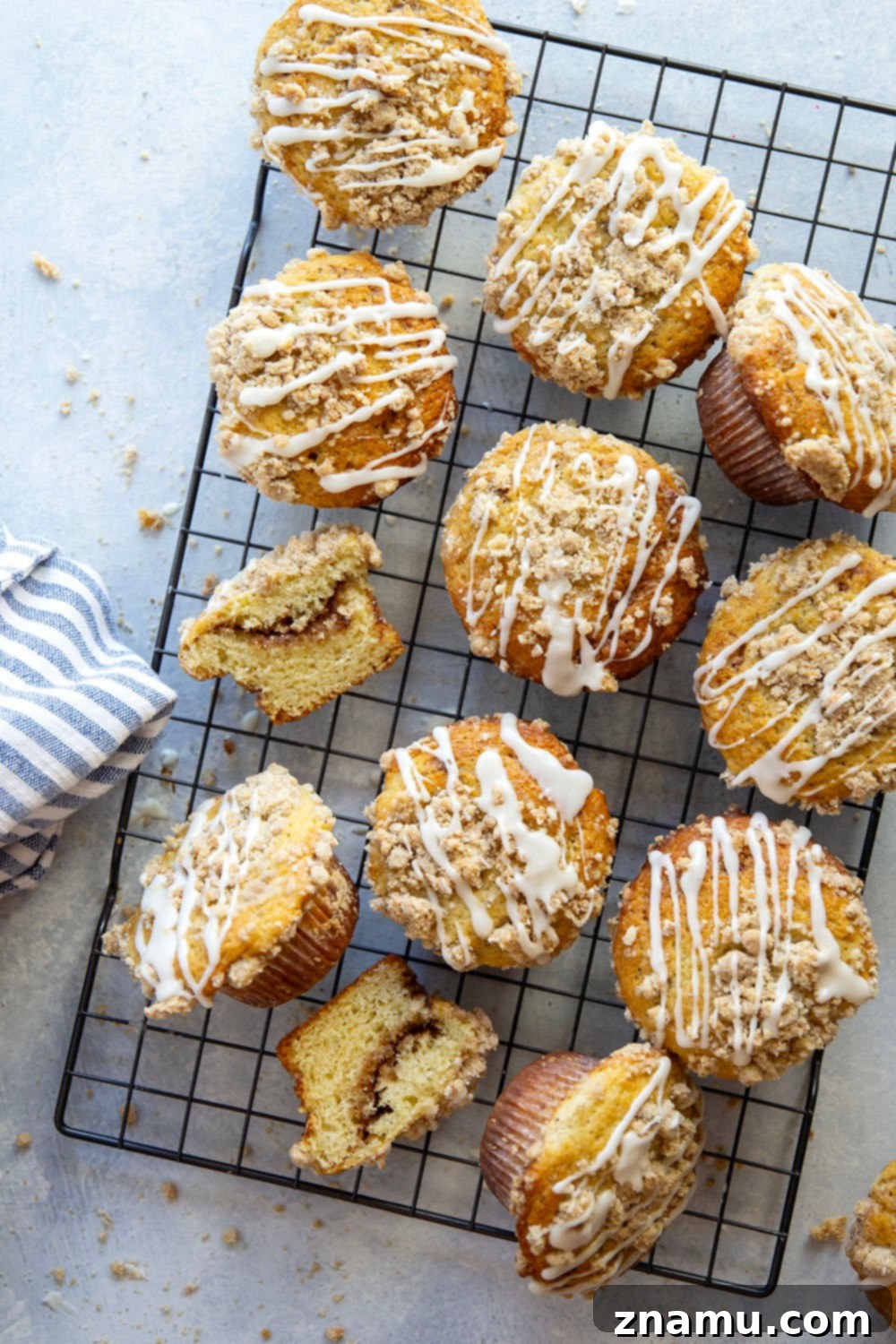 Streusel Coffee Cake Muffins 6 Hand holding a perfect Coffee Cake Muffin, showing off the fluffy interior and golden streusel.