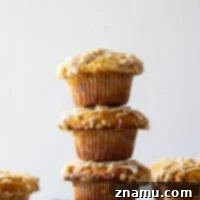 All of the flavors of classic coffee cake are wrapped up in these coffee cake muffins that include a cinnamon sugar center, buttery streusel, and lots of vanilla glaze.
