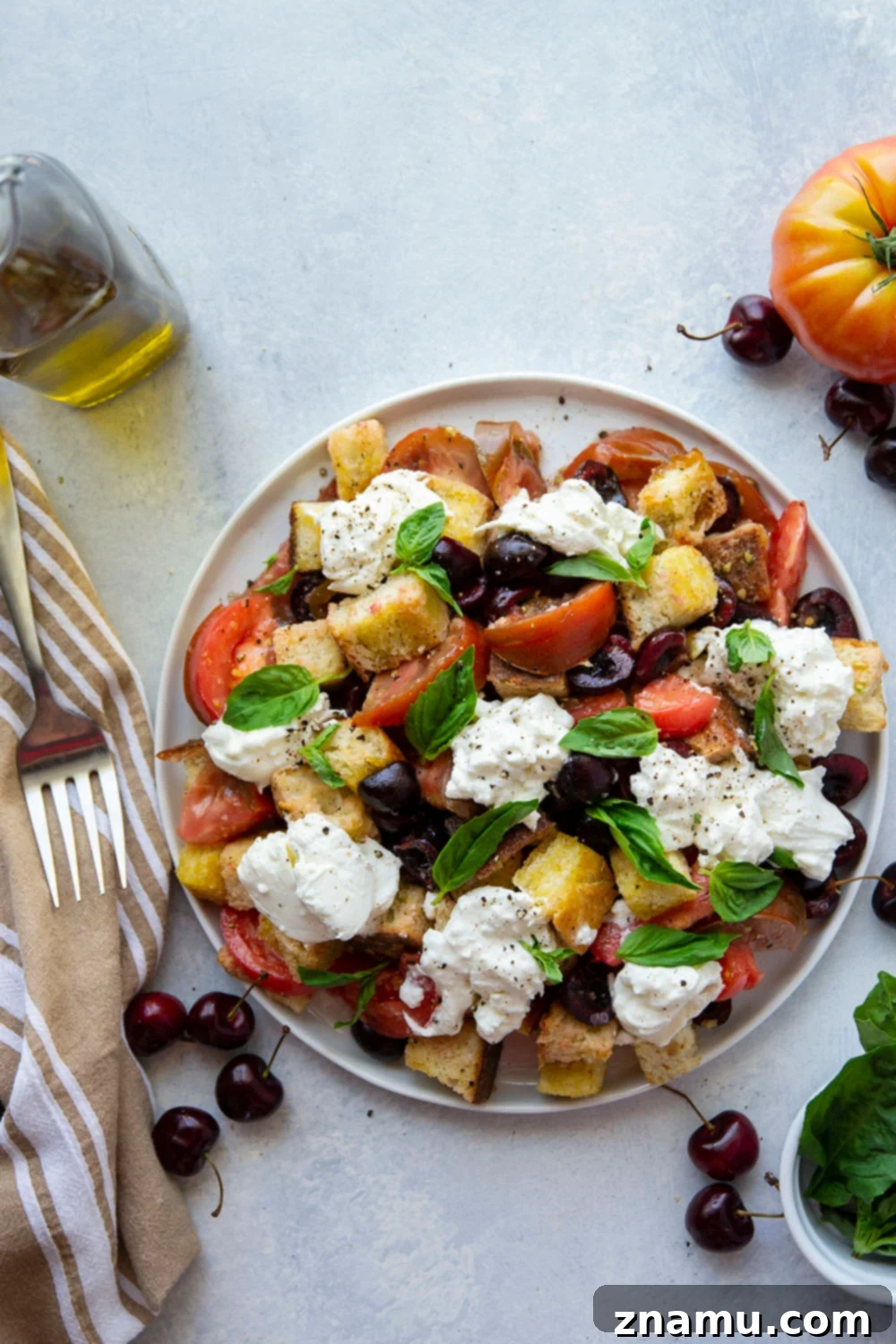 Vibrant Burrata & Cherry Panzanella 2 Vibrant Cherry Burrata Panzanella Salad featuring toasted artisan bread, ripe cherries, juicy tomatoes, creamy burrata, and a zesty white balsamic vinaigrette. An impressive and easy summer salad recipe.