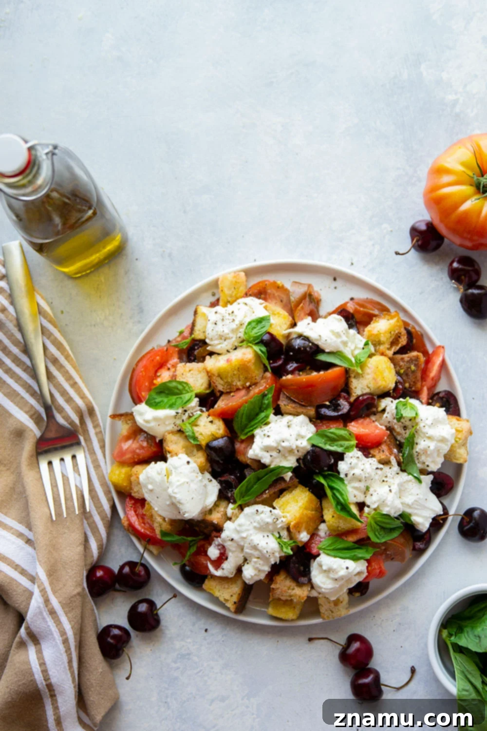 Vibrant Burrata & Cherry Panzanella 5 Rustic artisan bread cubes toasted to a golden brown, ready for the Cherry Burrata Panzanella Salad.