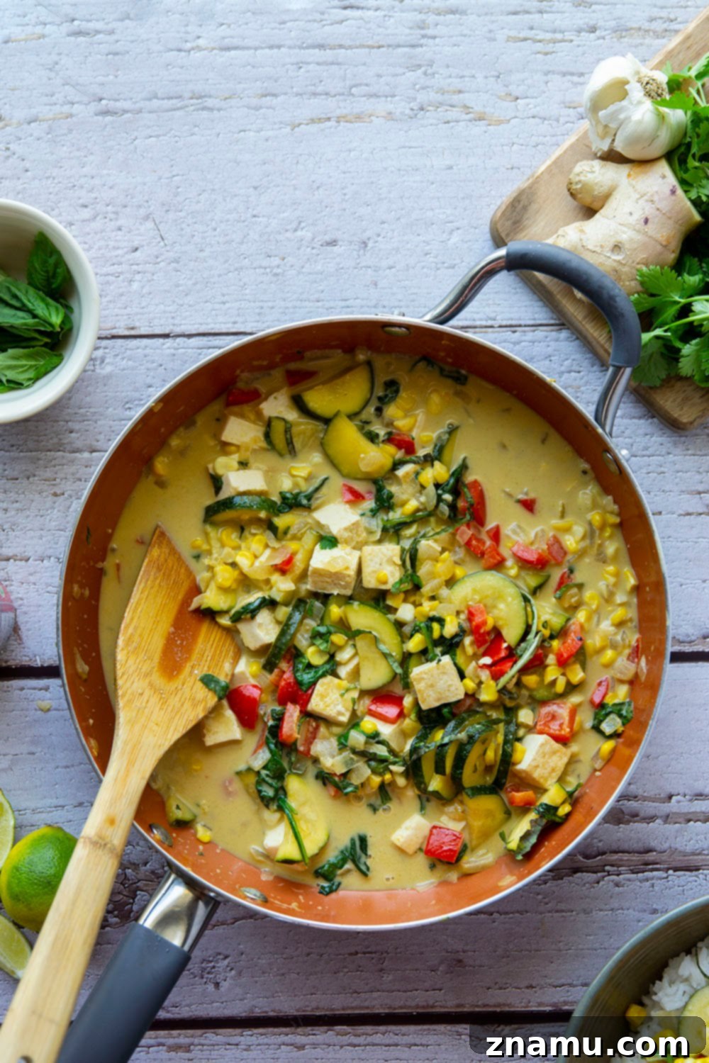 Beautifully plated Thai green curry tofu with rice, ready to be enjoyed.