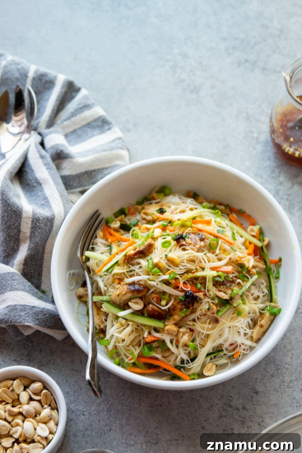 Chargrilled Chicken Vietnamese Noodle Bowl 3 Close-up of Vietnamese Noodle Salad with colorful ingredients and a zesty dressing.