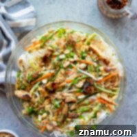 This Vietnamese noodle salad features tender vermicelli noodles with crisp veggies and smoky grilled chicken tossed in a tangy rice vinegar dressing.