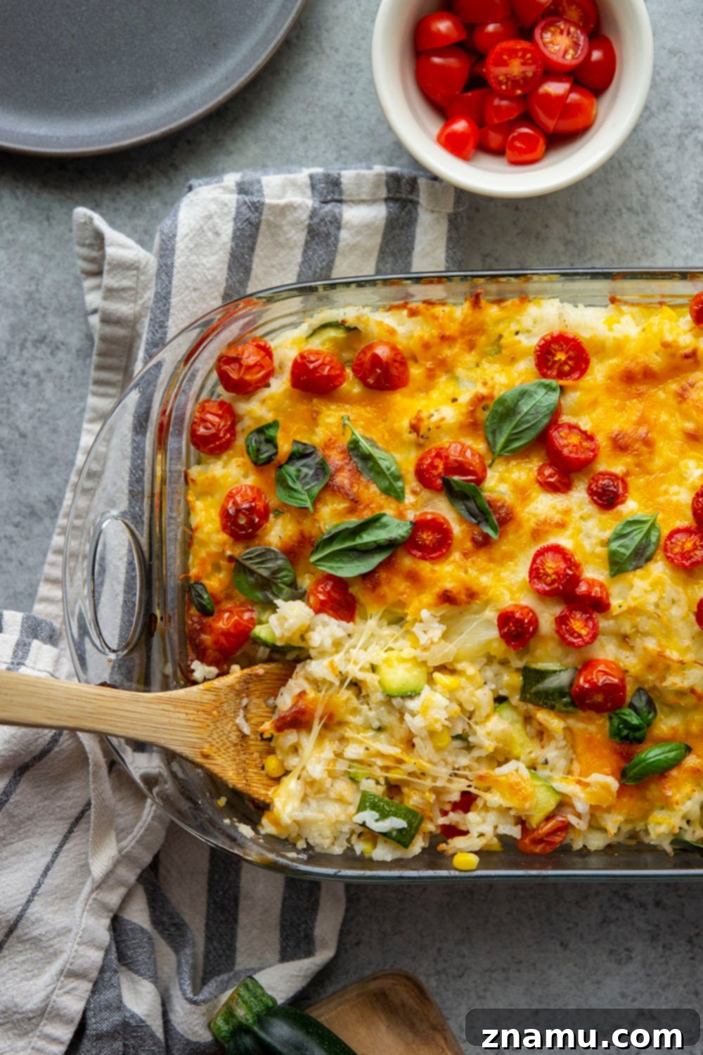 Golden Cheesy Zucchini Rice Bake 2 Loaded with cheese and lots of tender zucchini, this cheesy zucchini rice casserole is the perfect use for extra zucchini and the easiest comfort food to make with leftover rice!