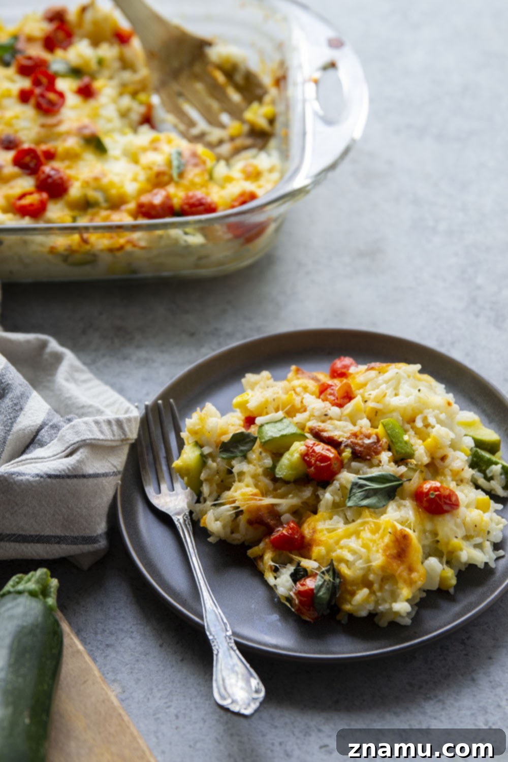 Golden Cheesy Zucchini Rice Bake 3 Loaded with cheese and lots of tender zucchini, this cheesy zucchini rice casserole is the perfect use for extra zucchini and the easiest comfort food to make with leftover rice!