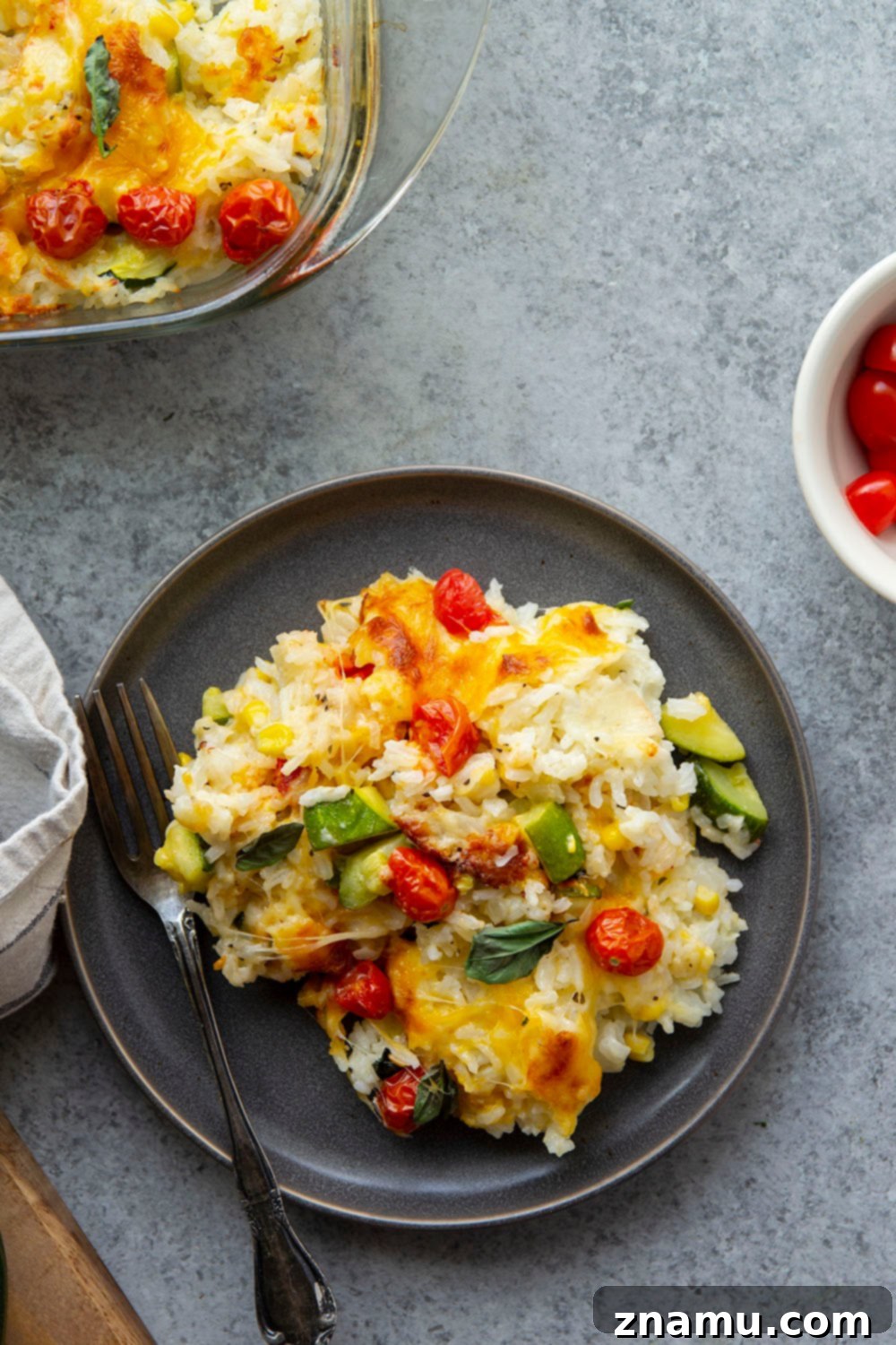 Golden Cheesy Zucchini Rice Bake 5 Loaded with cheese and lots of tender zucchini, this cheesy zucchini rice casserole is the perfect use for extra zucchini and the easiest comfort food to make with leftover rice!