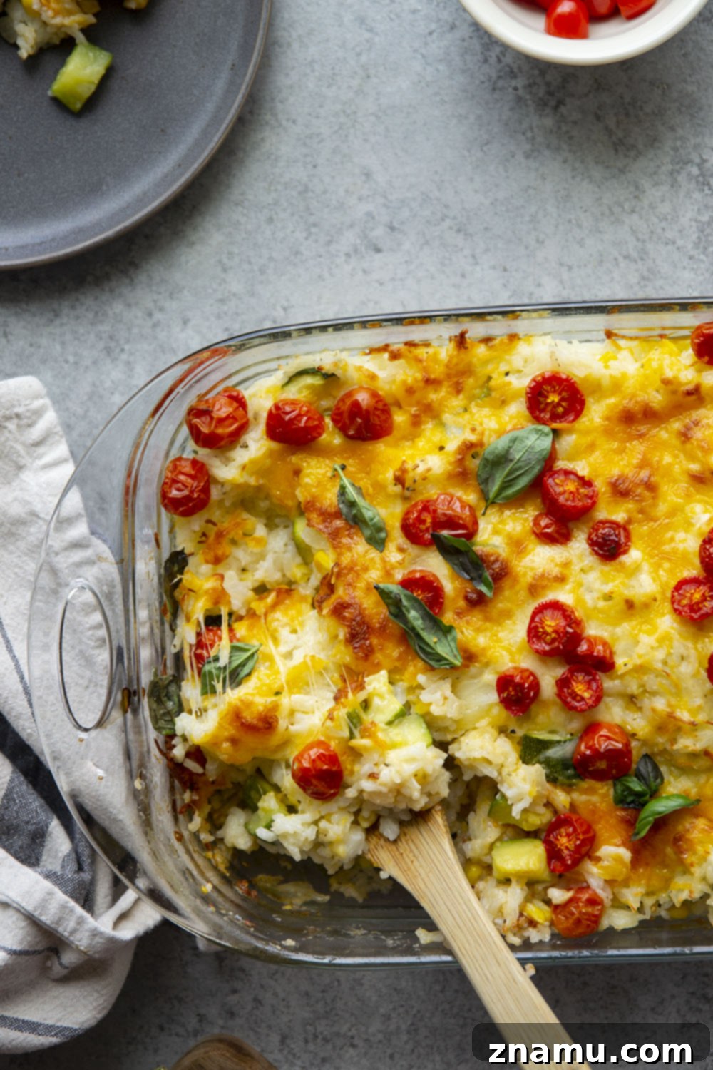 Golden Cheesy Zucchini Rice Bake 6 Loaded with cheese and lots of tender zucchini, this cheesy zucchini rice casserole is the perfect use for extra zucchini and the easiest comfort food to make with leftover rice!