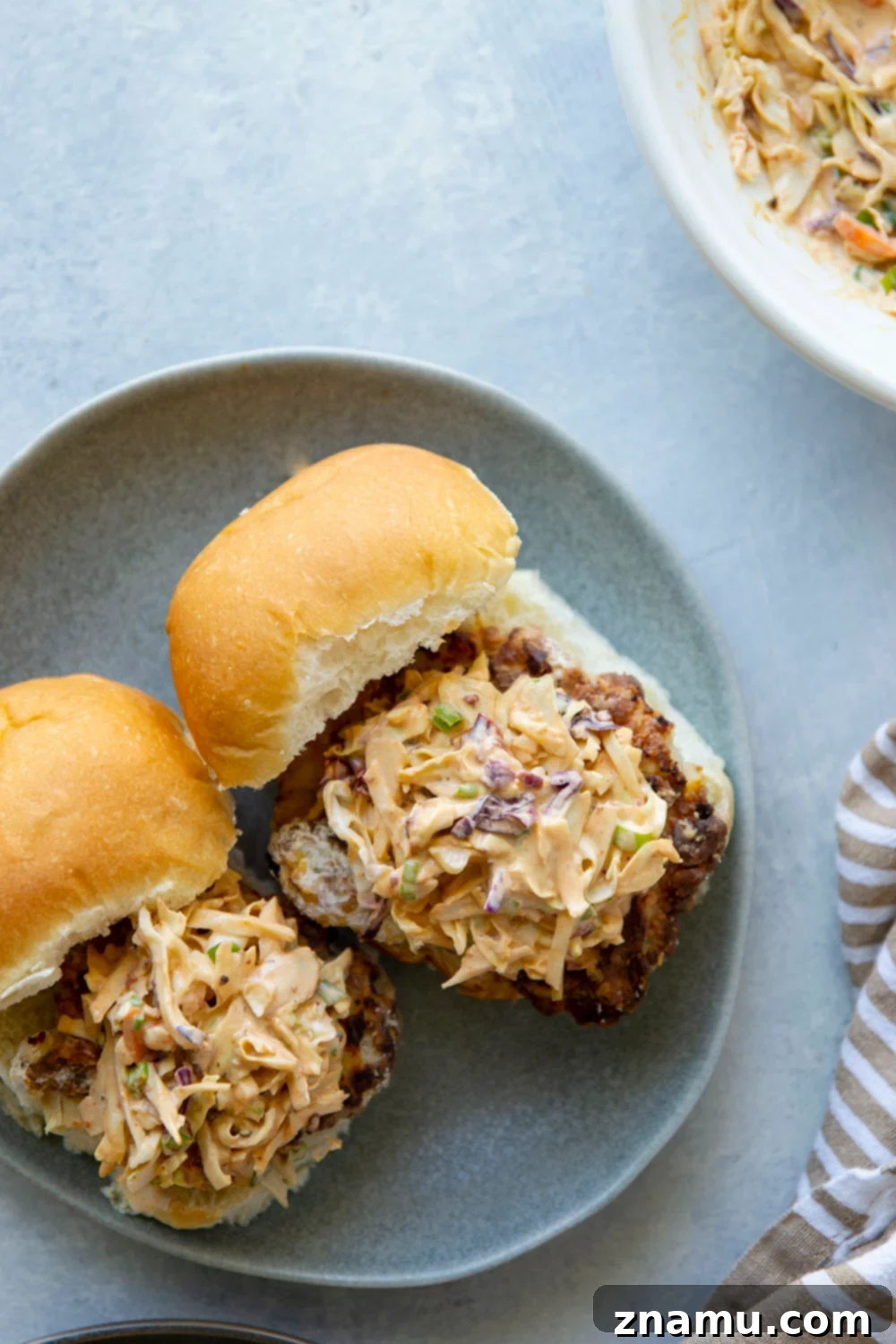 Crispy Air-Fried Chicken Sandwich with Smoky Chipotle Slaw 2 Crispy Air Fryer Chicken Sandwich with spicy chipotle slaw, served on a toasted bun.