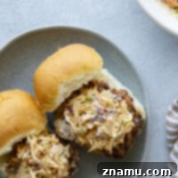 Crispy fried chicken thighs and lots of spicy chipotle slaw are the perfect duo in this air fryer chicken sandwich.