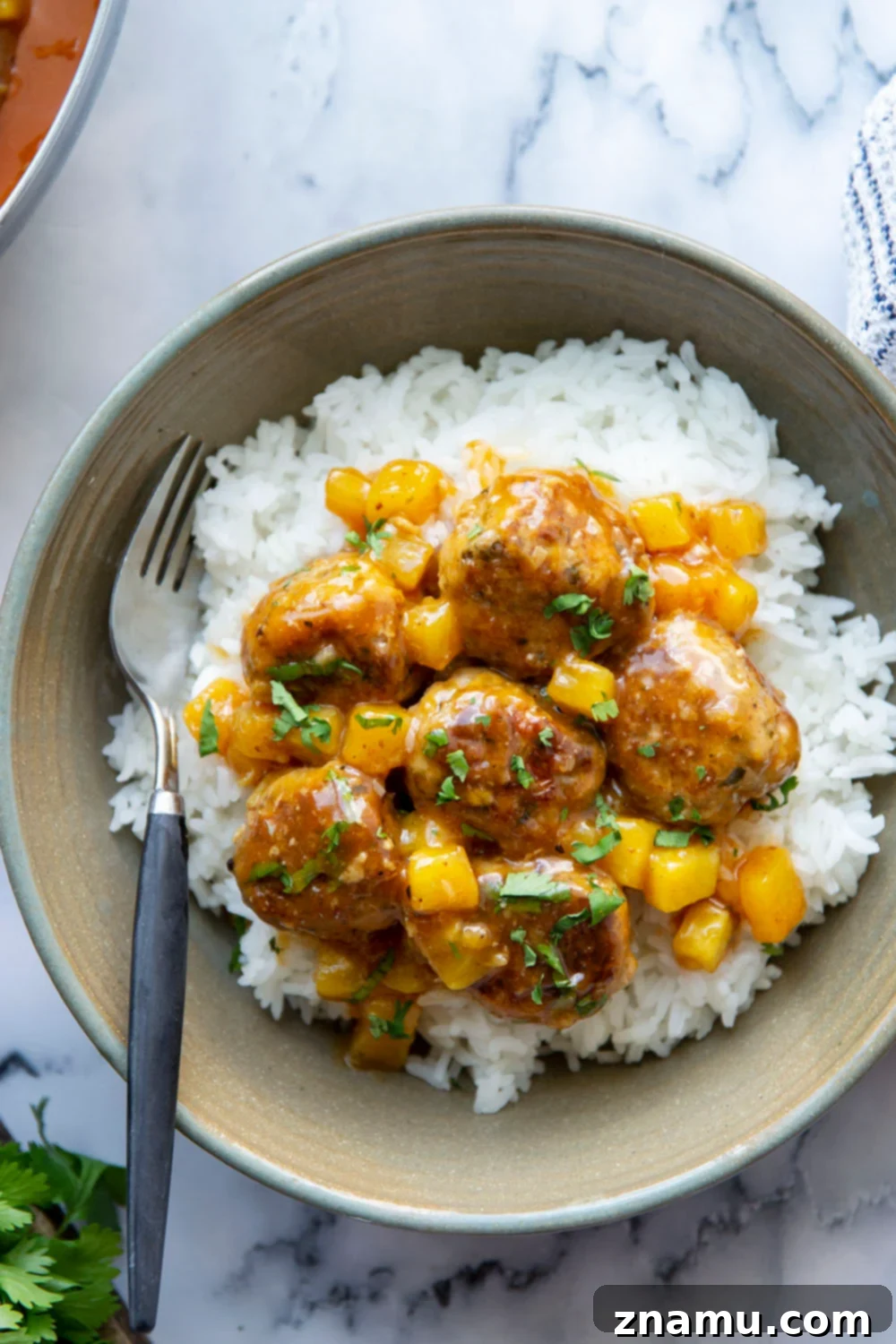 Pineapple Glazed Jerk Chicken Bites 4 Spicy jerk chicken meatballs simmered in a sweet and perfectly sticky pineapple sauce are packed full of flavor and heavenly served over fluffy rice!