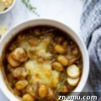 Savory Onion Gnocchi Gratin 8 This baked French onion gnocchi is like a heartier version of the classic soup! Tender gnocchi is baked in a flavorful caramelized onion beef broth with lots of rich cheese on top and French bread slices for dipping.