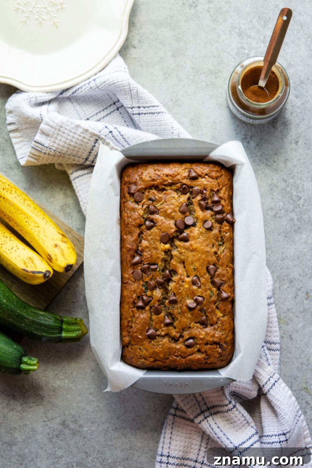 Espresso Infused Banana Zucchini Bread 3 A close-up of a slice of Espresso Banana Zucchini Bread with chocolate chips, showcasing its moist texture.