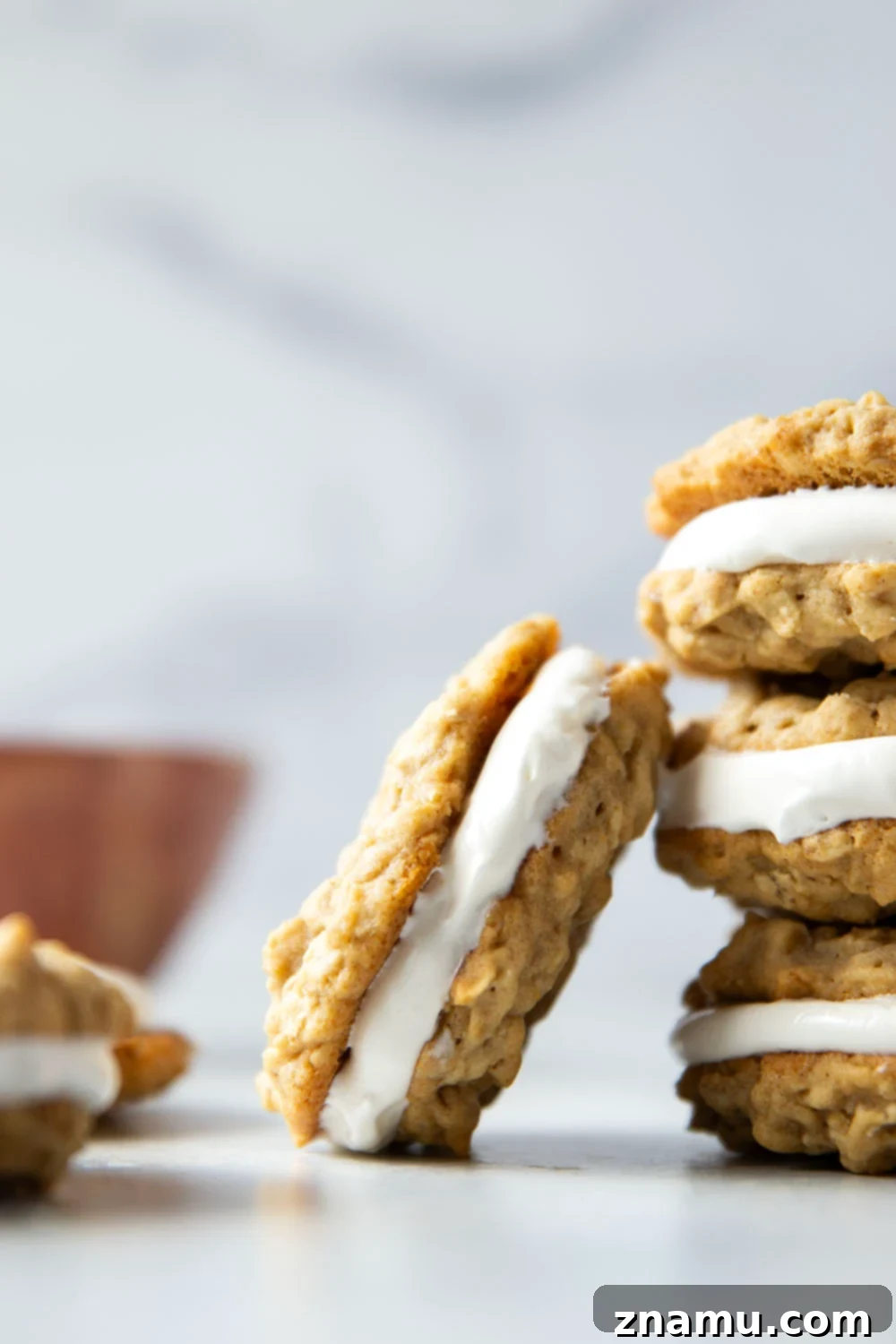 Homemade Oatmeal Creamy Delights 2 A stack of delicious homemade oatmeal cream pies, showing the soft cookies and fluffy white filling