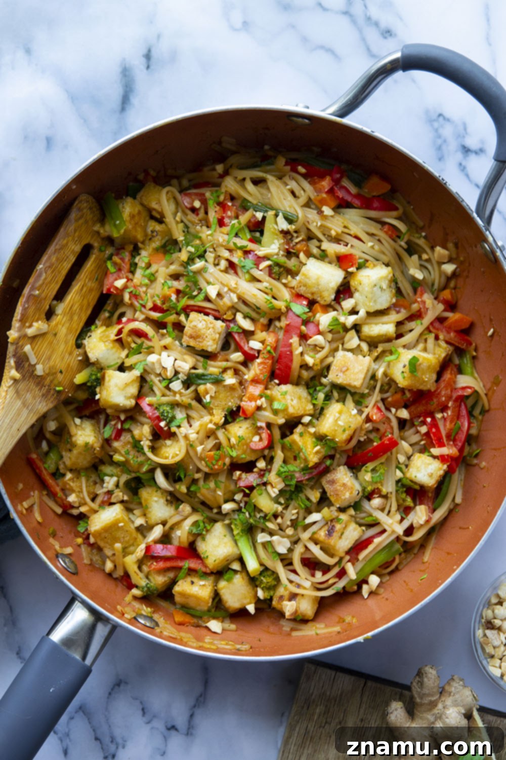 Creamy Peanut Satay Tofu Noodles 5 A bowl of pressed and diced tofu coated in cornstarch, ready for frying.