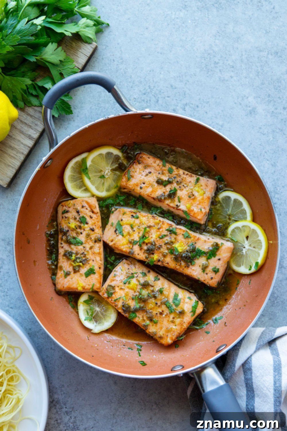 Weeknight Salmon Piccata Skillet 2 One Pan Salmon Piccata: Seared salmon fillets in a lemon caper sauce, made in 30 minutes.