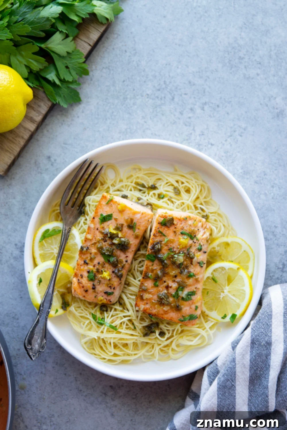 Weeknight Salmon Piccata Skillet 3 Close-up of One Pan Salmon Piccata with lemon slices and capers.