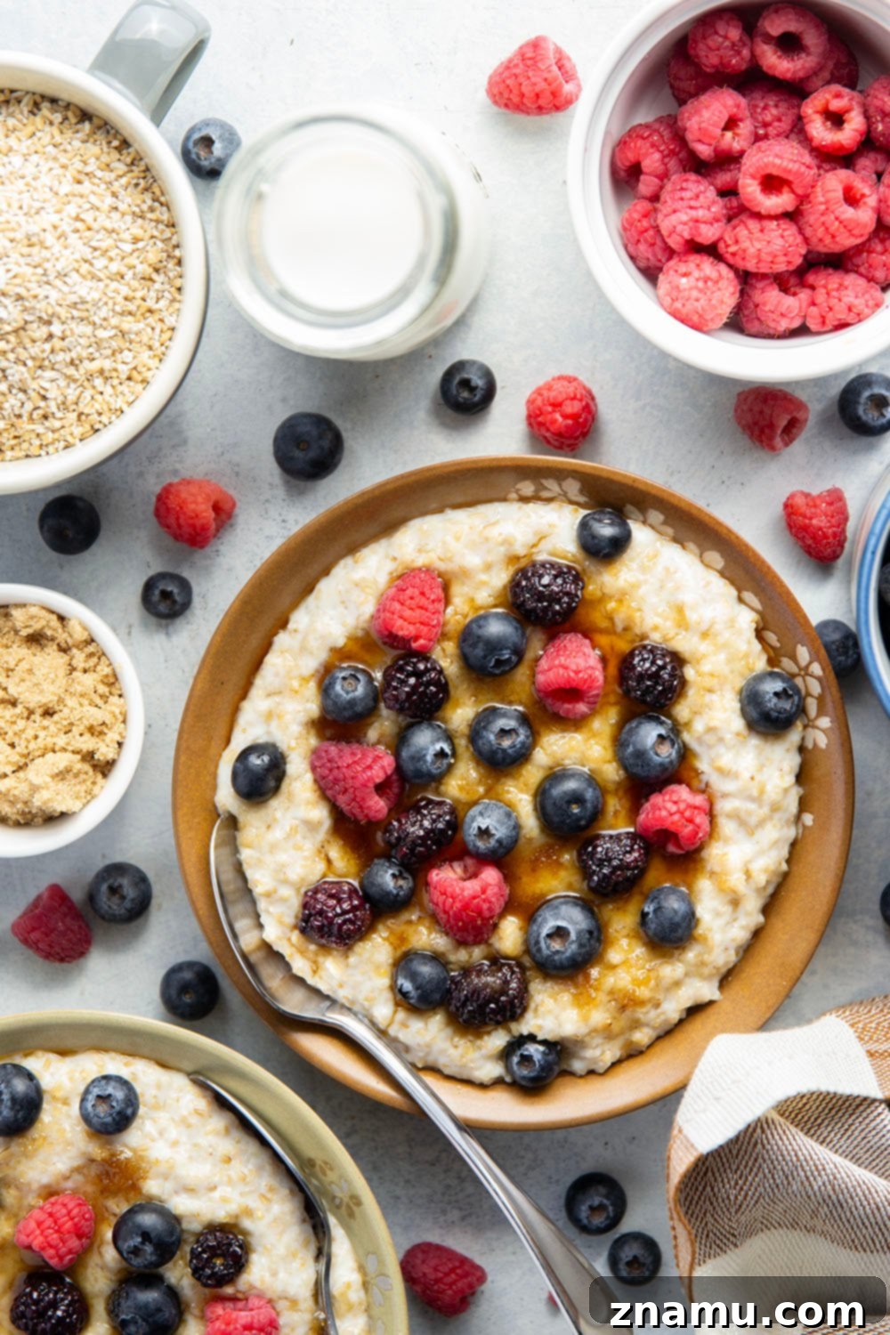 The Secret to Irresistible Steel-Cut Oats 2 A perfectly cooked bowl of creamy steel cut oats topped with fresh berries and a drizzle of honey.