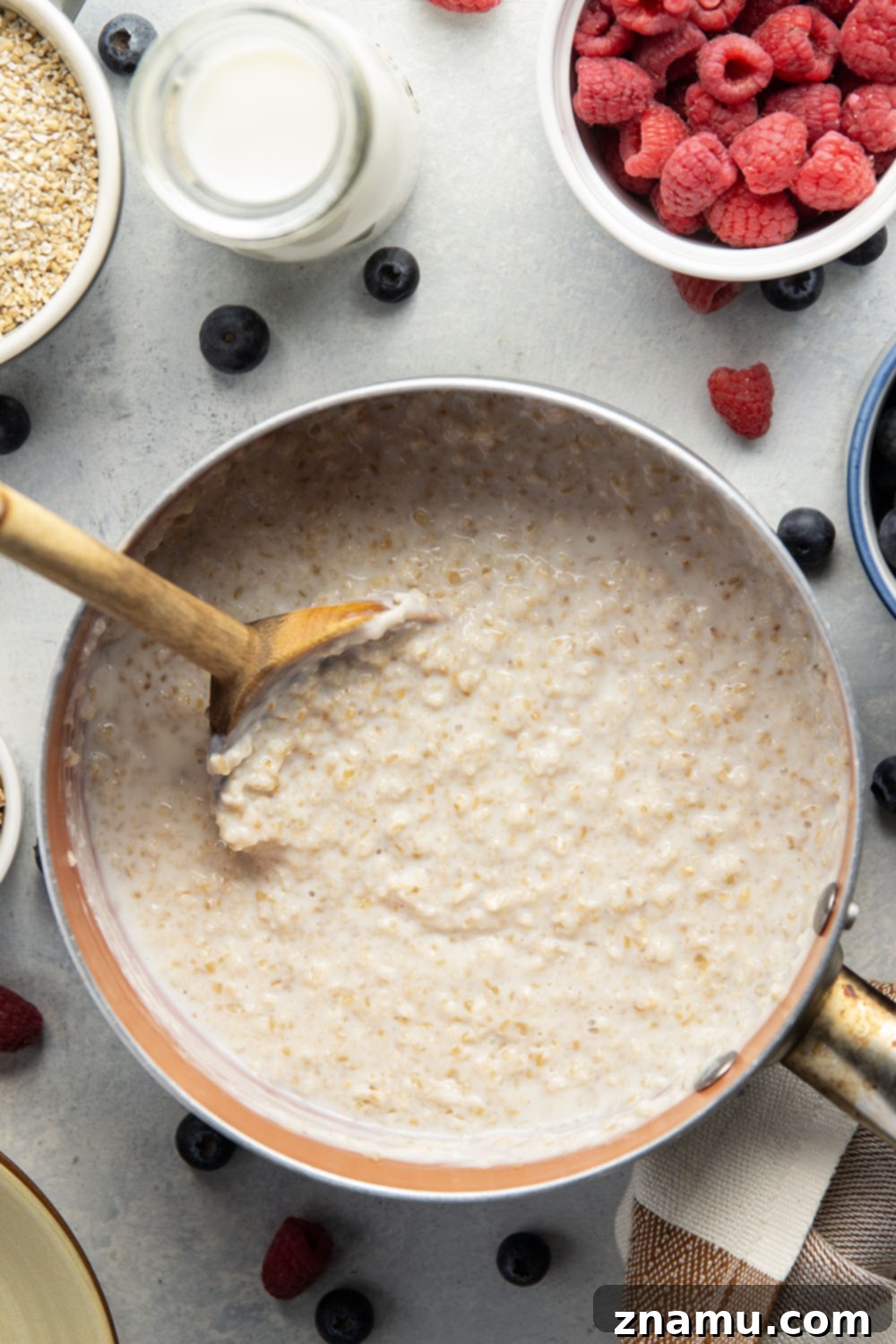 The Secret to Irresistible Steel-Cut Oats 5 A bowl of uncooked steel cut oats on a wooden surface.
