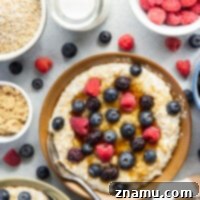 The Secret to Irresistible Steel-Cut Oats 8 Perfectly cooked steel cut oats with milk and a spoon.
