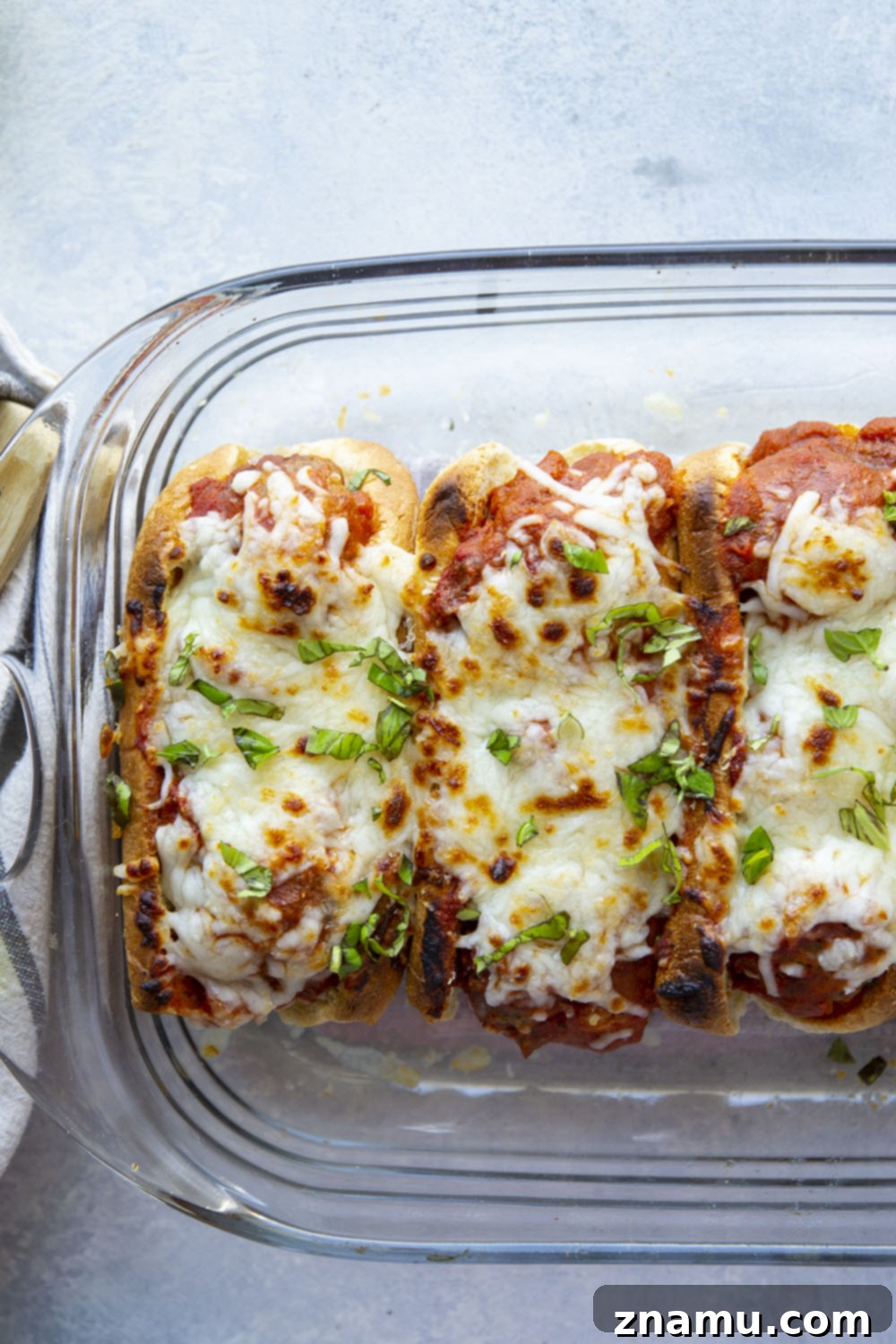 Cheesy Baked Meatball Subs 4 Ingredients laid out for making meatball marinara subs, including ground beef, sauce, and cheese.