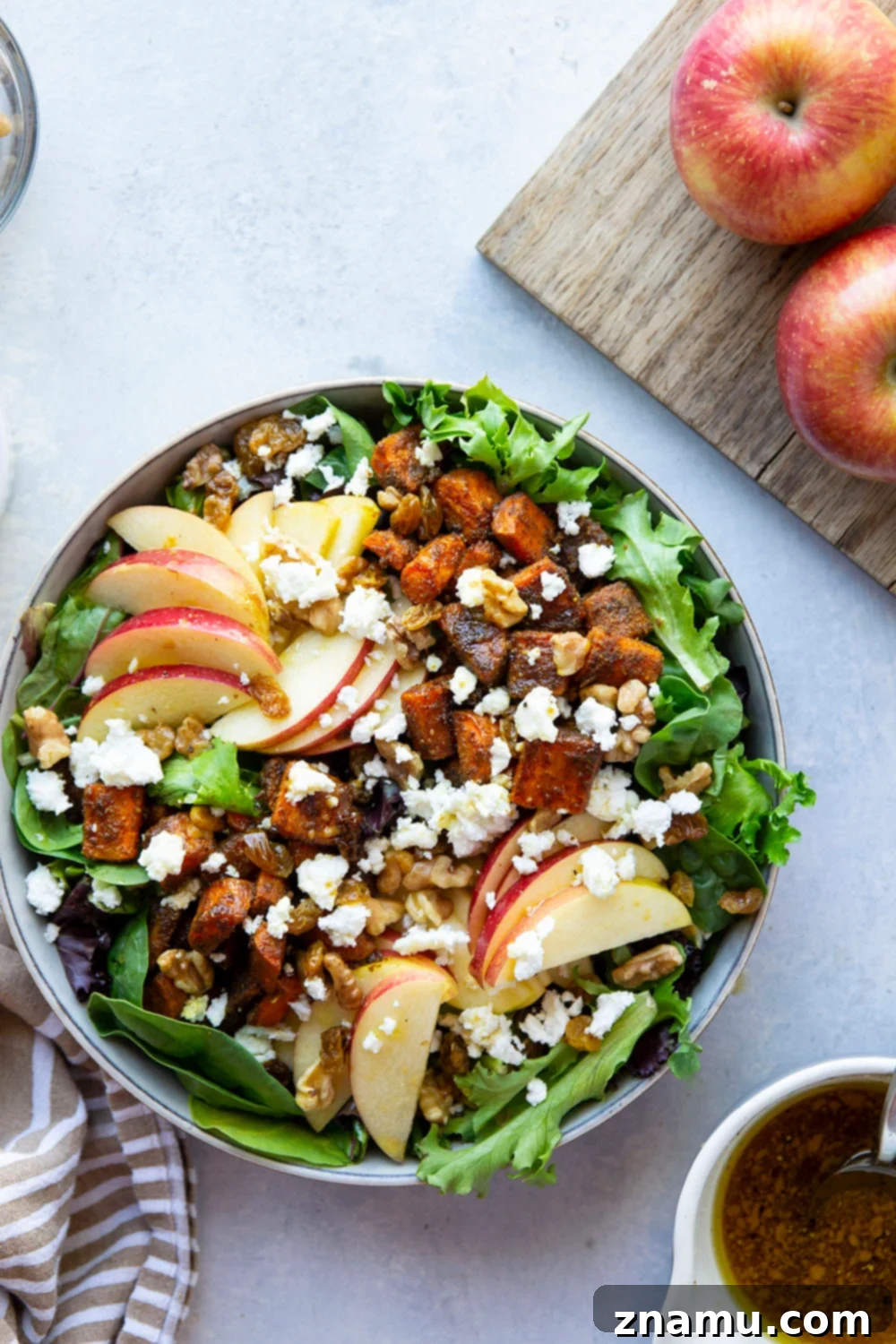 Roasted Moroccan Carrot and Apple Salad 2 Moroccan spice-roasted carrots and crisp apples come together in a vibrant autumn salad with maple dressing.