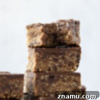 Thick and chewy no-bake cookie dough bars that are secretly healthy and packed with 12 grams protein per serving!