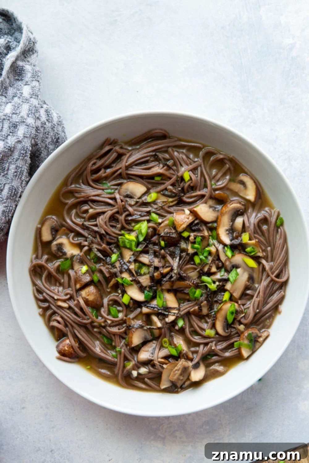 Soulful Miso Mushroom Noodles 4 Overhead view of a Miso Mushroom Noodle Soup bowl, garnished and ready to eat.