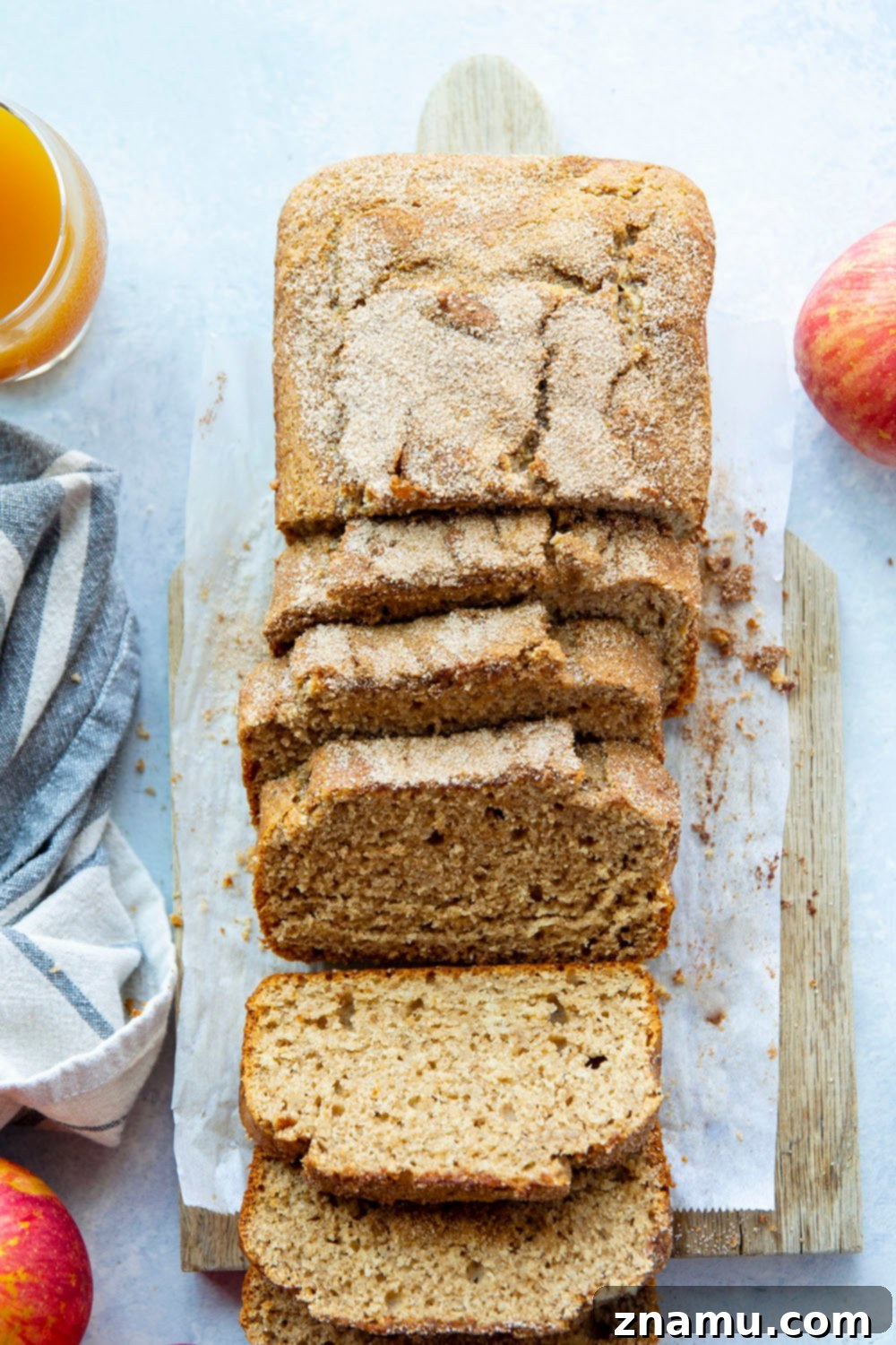 Autumn Orchard Donut Loaf 2 A beautifully baked loaf of Apple Cider Donut Bread, glistening with a cinnamon sugar topping, perfect for fall baking