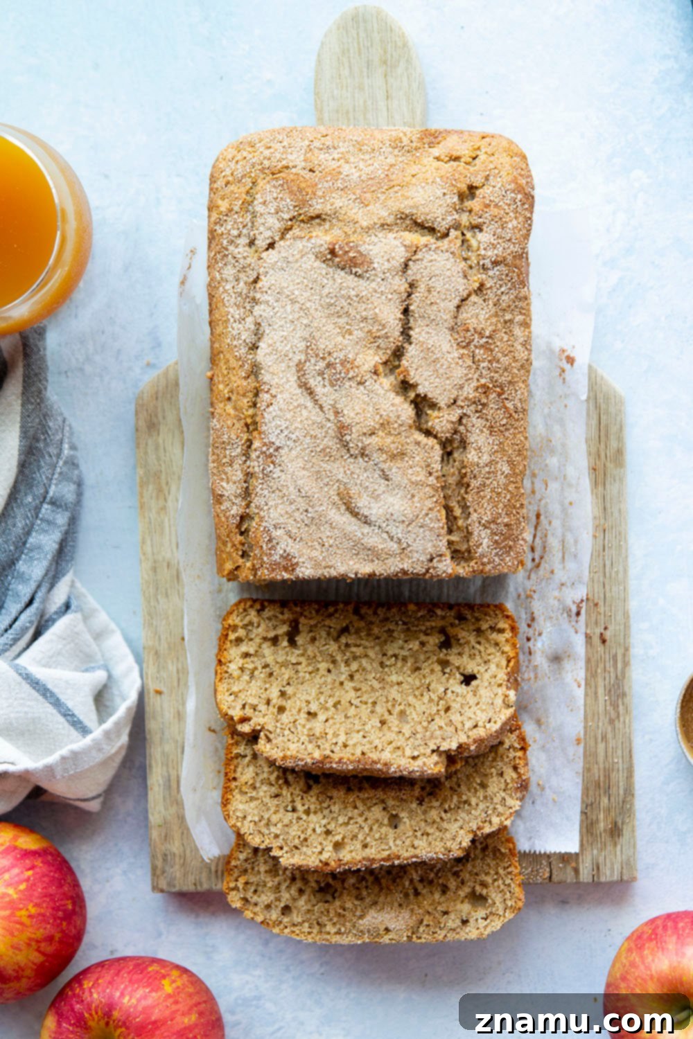 Autumn Orchard Donut Loaf 5 A loaf of Apple Cider Donut Bread cooling on a wire rack, filling the kitchen with fall aromas