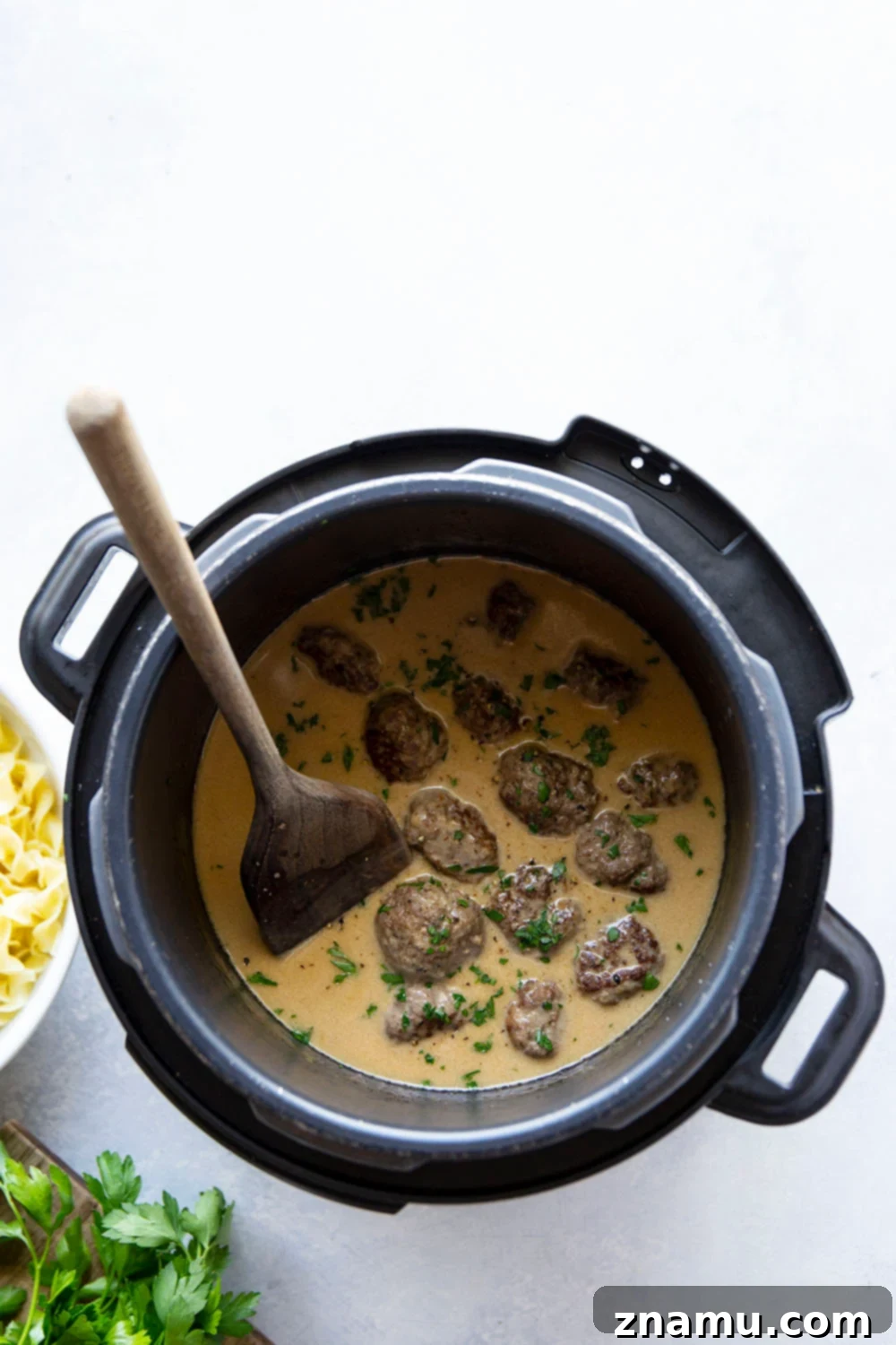 Instant Pot Swedish Meatballs: A Cozy Classic 3 Close-up shot of creamy Swedish meatballs in an Instant Pot, ready to be served.