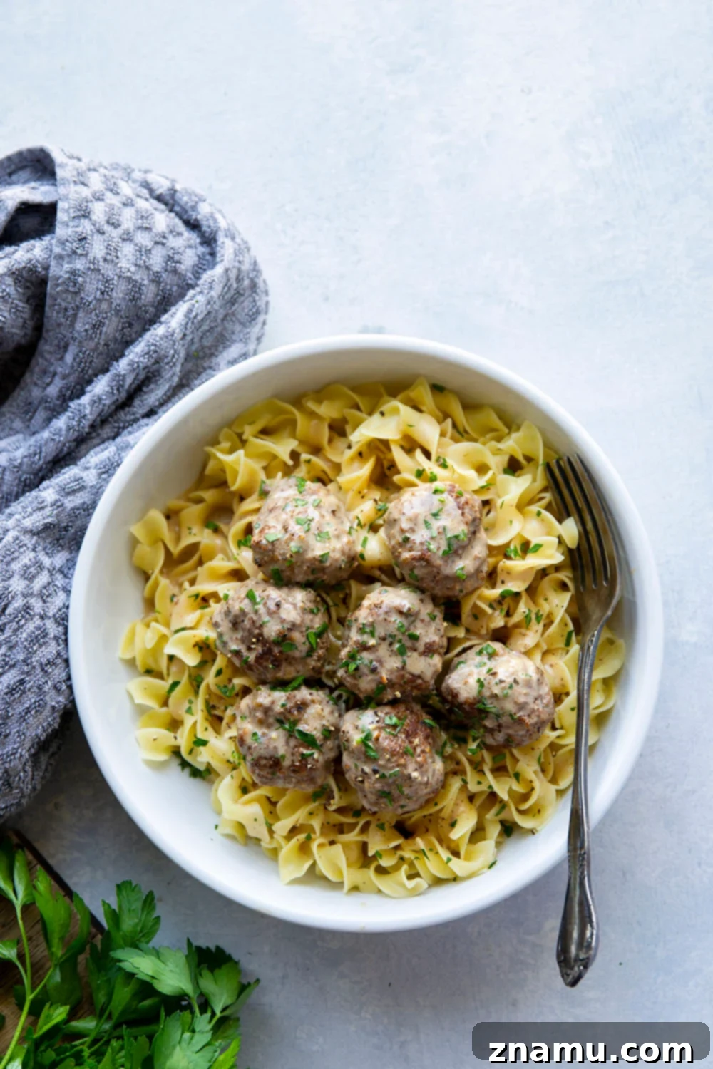 Instant Pot Swedish Meatballs: A Cozy Classic 5 Close-up of golden-brown Instant Pot Swedish meatballs with creamy sauce in a bowl.