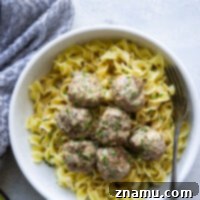 Instant Pot Swedish Meatballs ready to be served over egg noodles.