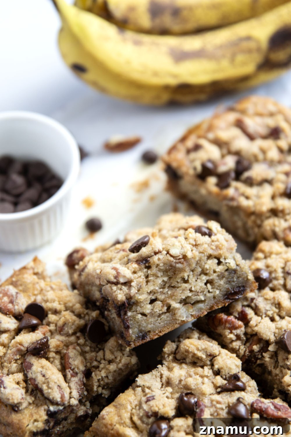 Banana & Chocolate Chip Coffee Cake 4 A baked banana chocolate chip coffee cake cooling on a wire rack, topped with golden pecan streusel.