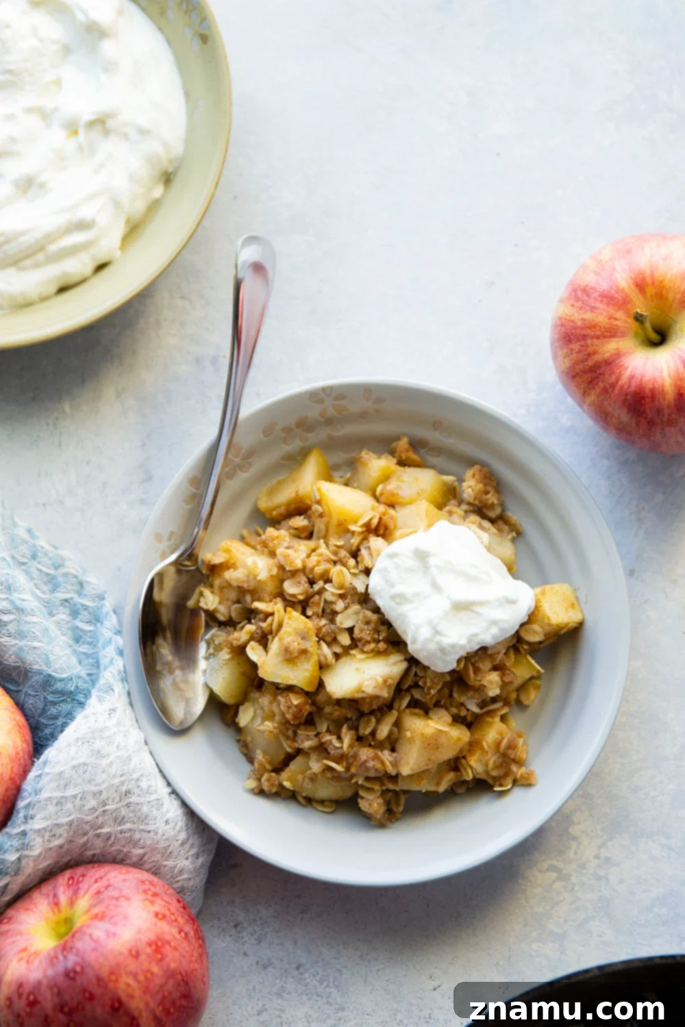 Zingy Ginger Apple Skillet Crisp 3 Skillet Ginger Apple Crisp in a cast iron pan, fresh out of the oven, showing its golden, bubbly topping.