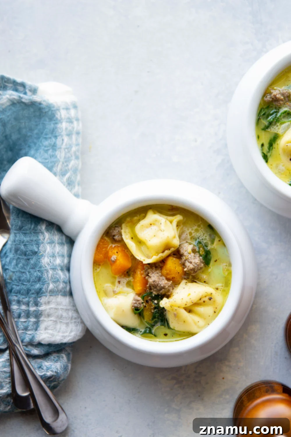Hearty Sausage and Butternut Tortellini Soup 2 A hearty bowl of Butternut Squash Tortellini Soup, filled with savory sausage, tender squash, and cheesy tortellini, perfect for a cozy weeknight meal.