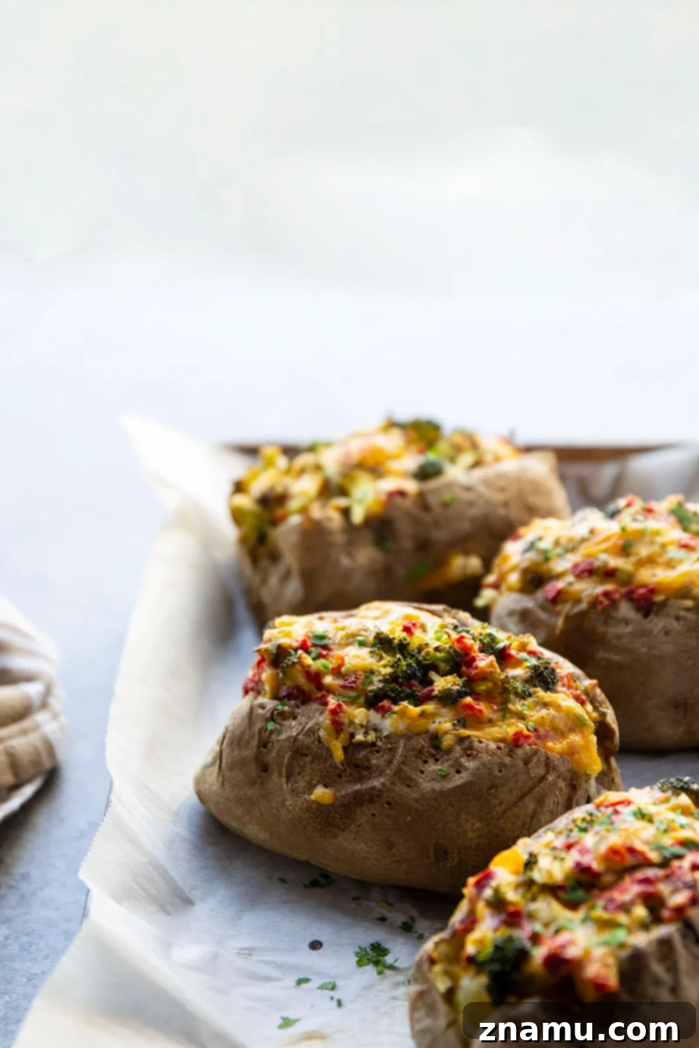 Loaded Broccoli Cheddar Potatoes 3 Close-up of a loaded Broccoli Cheddar Baked Potato, showcasing the cheesy broccoli filling.