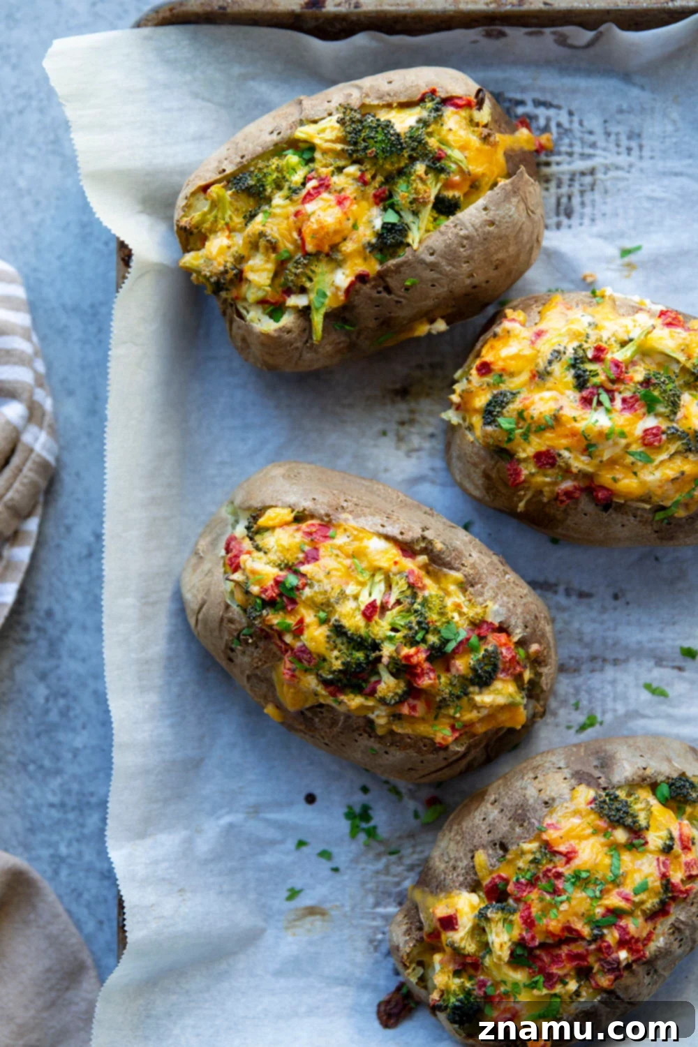 Loaded Broccoli Cheddar Potatoes 5 Ingredients laid out for making Broccoli Cheddar Baked Potatoes, including russets, broccoli, and cheese.