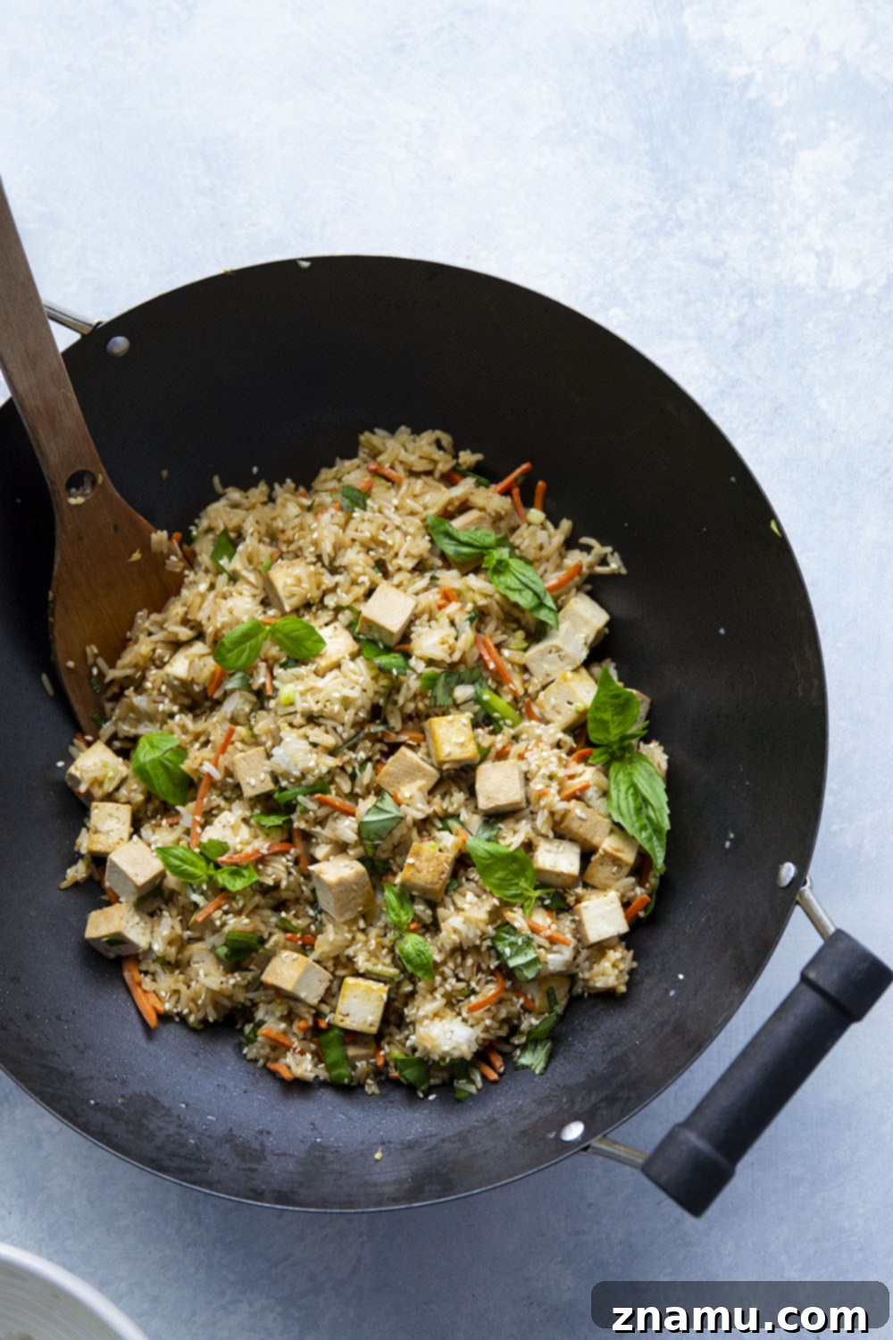 Crispy Sesame Tofu with Aromatic Thai Basil Fried Rice 3 This Thai basil fried rice features the most flavorful basil fried rice with lots of crispy sesame marinated tofu. - it's so easy to make in minutes using leftover cooked rice!