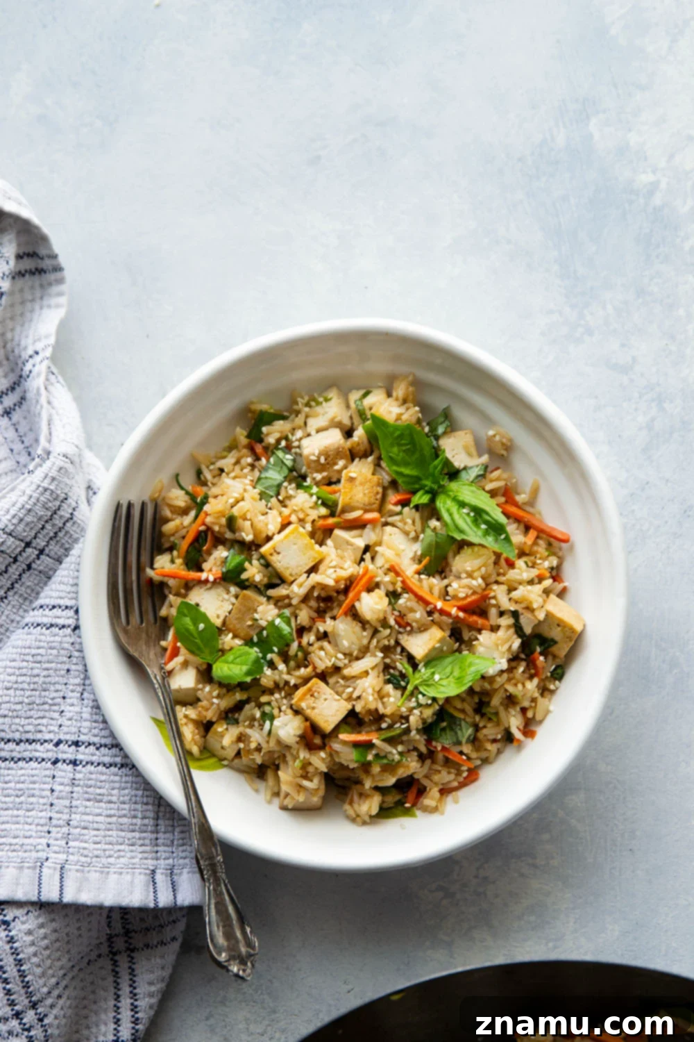 Crispy Sesame Tofu with Aromatic Thai Basil Fried Rice 4 This Thai basil fried rice features the most flavorful basil fried rice with lots of crispy sesame marinated tofu. - it's so easy to make in minutes using leftover cooked rice!