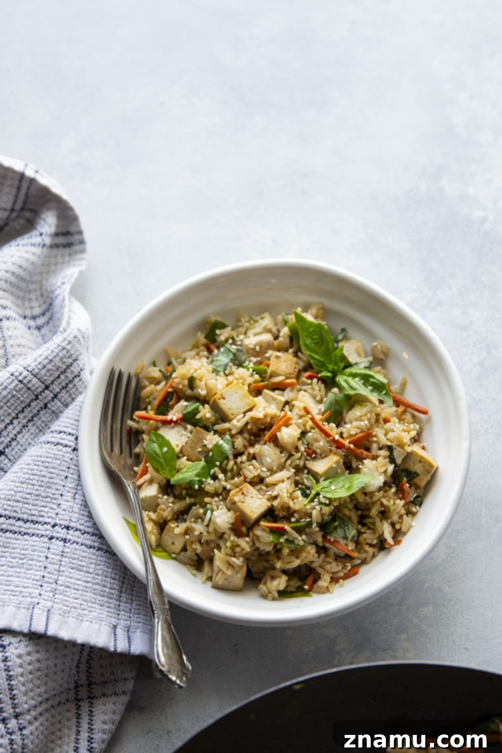Crispy Sesame Tofu with Aromatic Thai Basil Fried Rice 6 This Thai basil fried rice features the most flavorful basil fried rice with lots of crispy sesame marinated tofu. - it's so easy to make in minutes using leftover cooked rice!