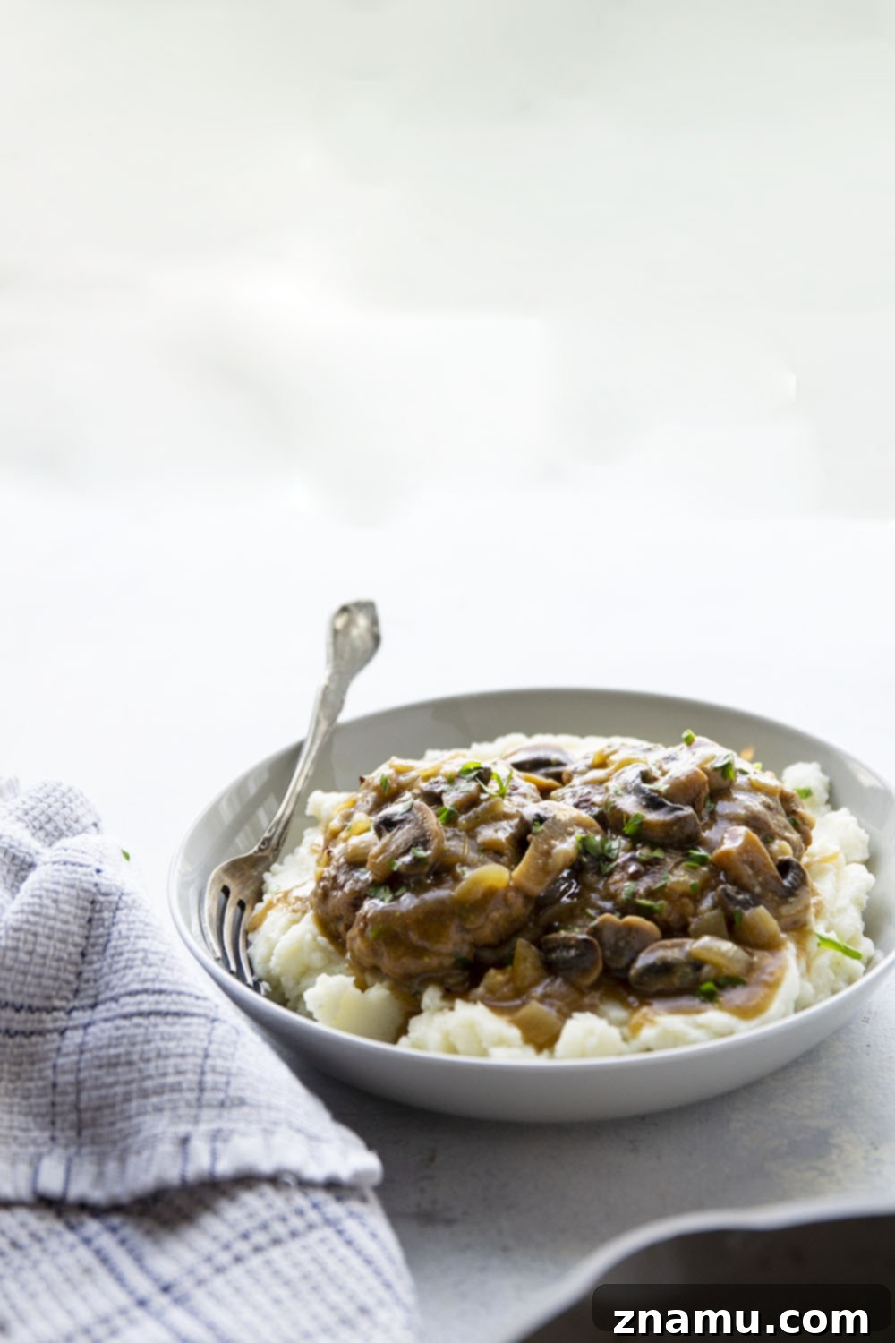 Simple One Pan Salisbury Steak 5 This one pan Salisbury steak features the most tender steaks simmered in a rich mushroom gravy sauce. Absolutely to die for over a bowl of creamy mashed potatoes!