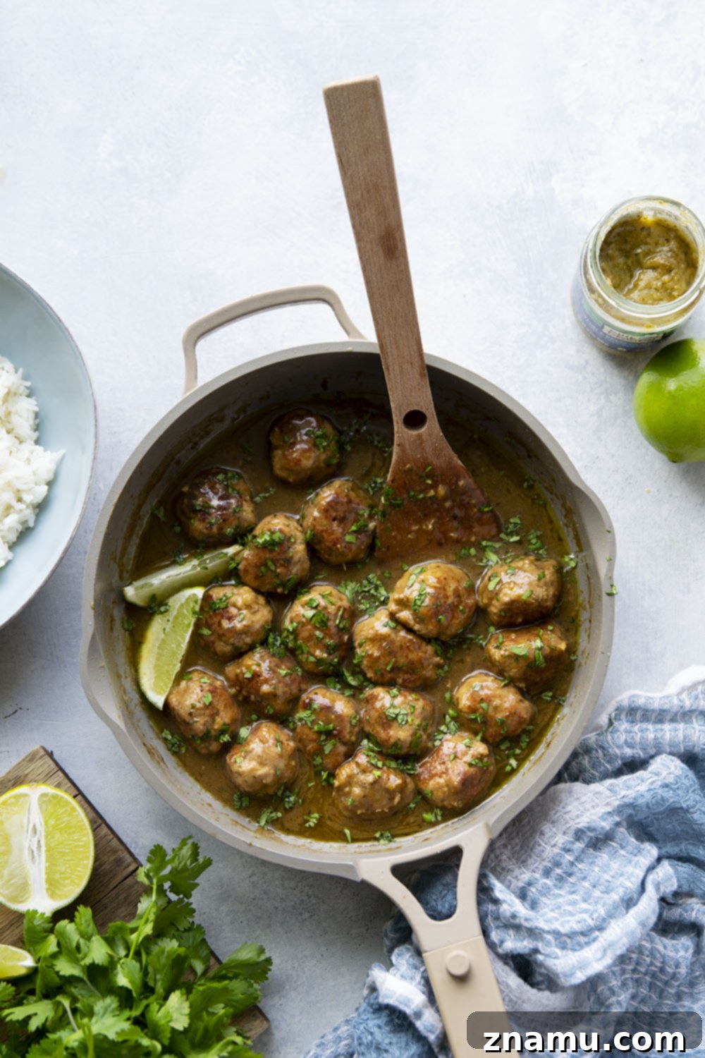 Ginger-Kissed Emerald Curry Chicken Meatballs 4 These green curry chicken meatballs feature tender chicken meatballs simmered in the most amazing gingery green curry sauce. Serve over a pile of hot rice with lots of fresh cilantro and lime!